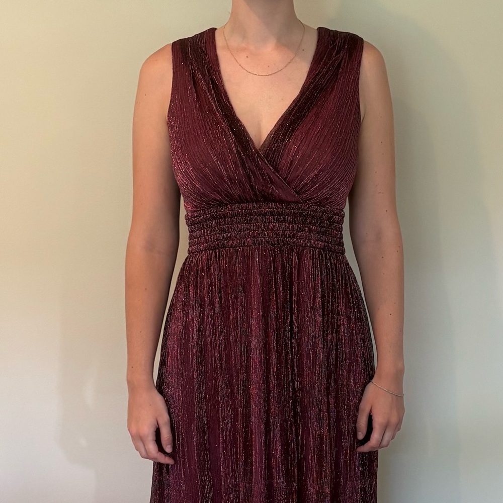 Long sparkly sleeveless gown. Great for the festive holiday season or wedding.